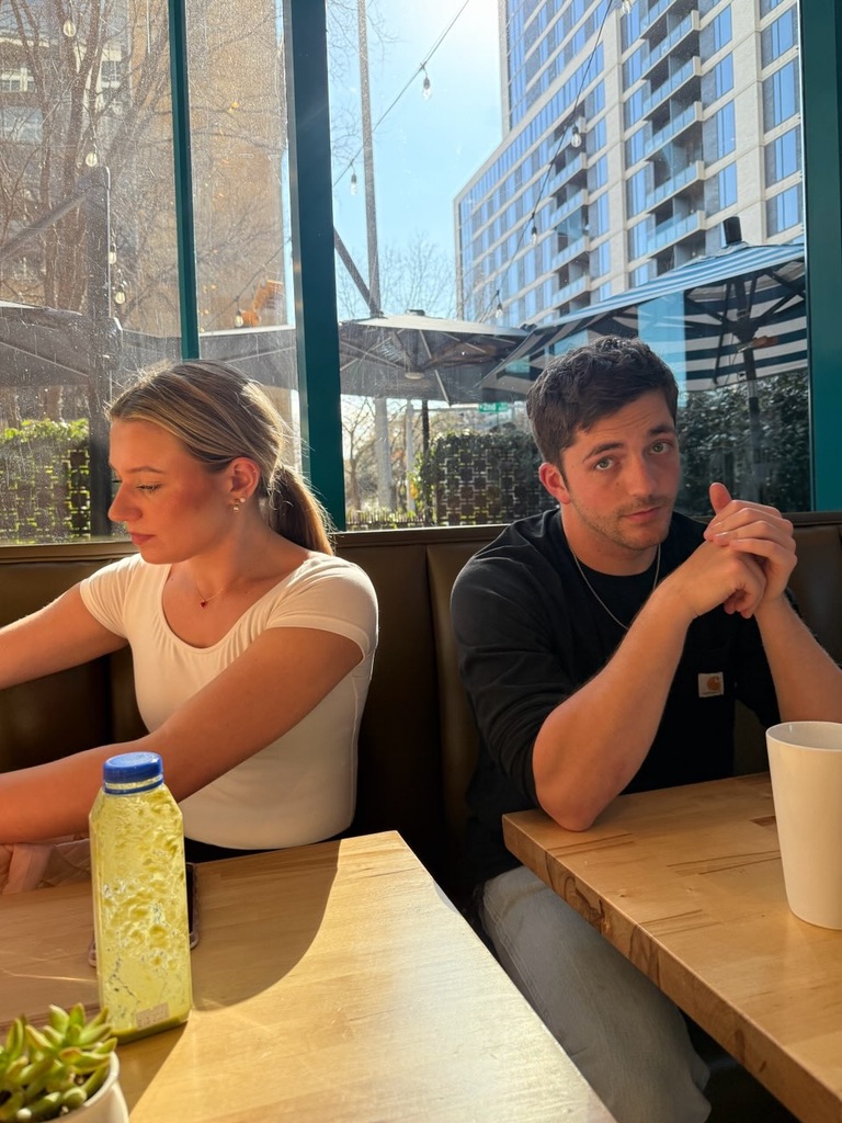 Macie and Kenny at a sunny café