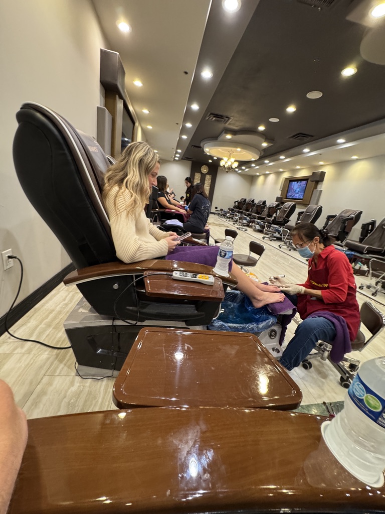 Macie relaxing at the nail salon