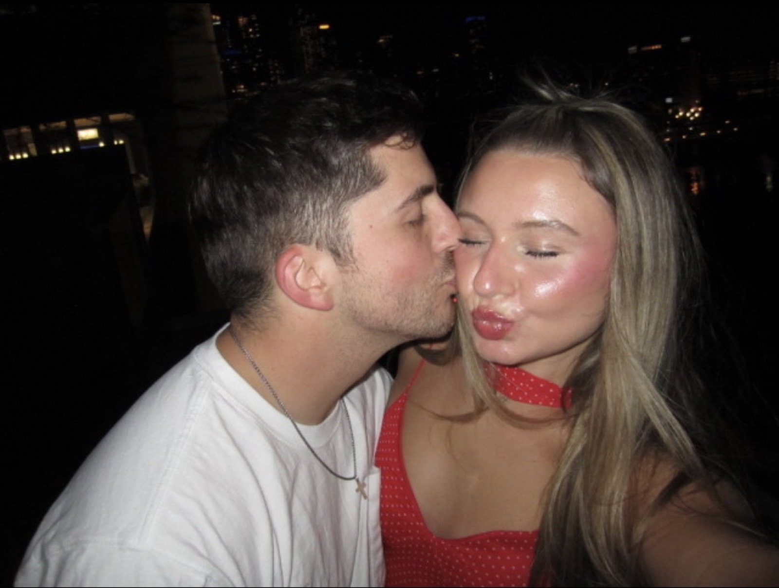 Kenny kissing Macie on the cheek